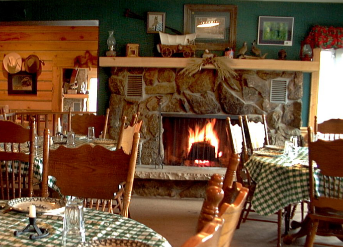 cozy ranch dining room with fire