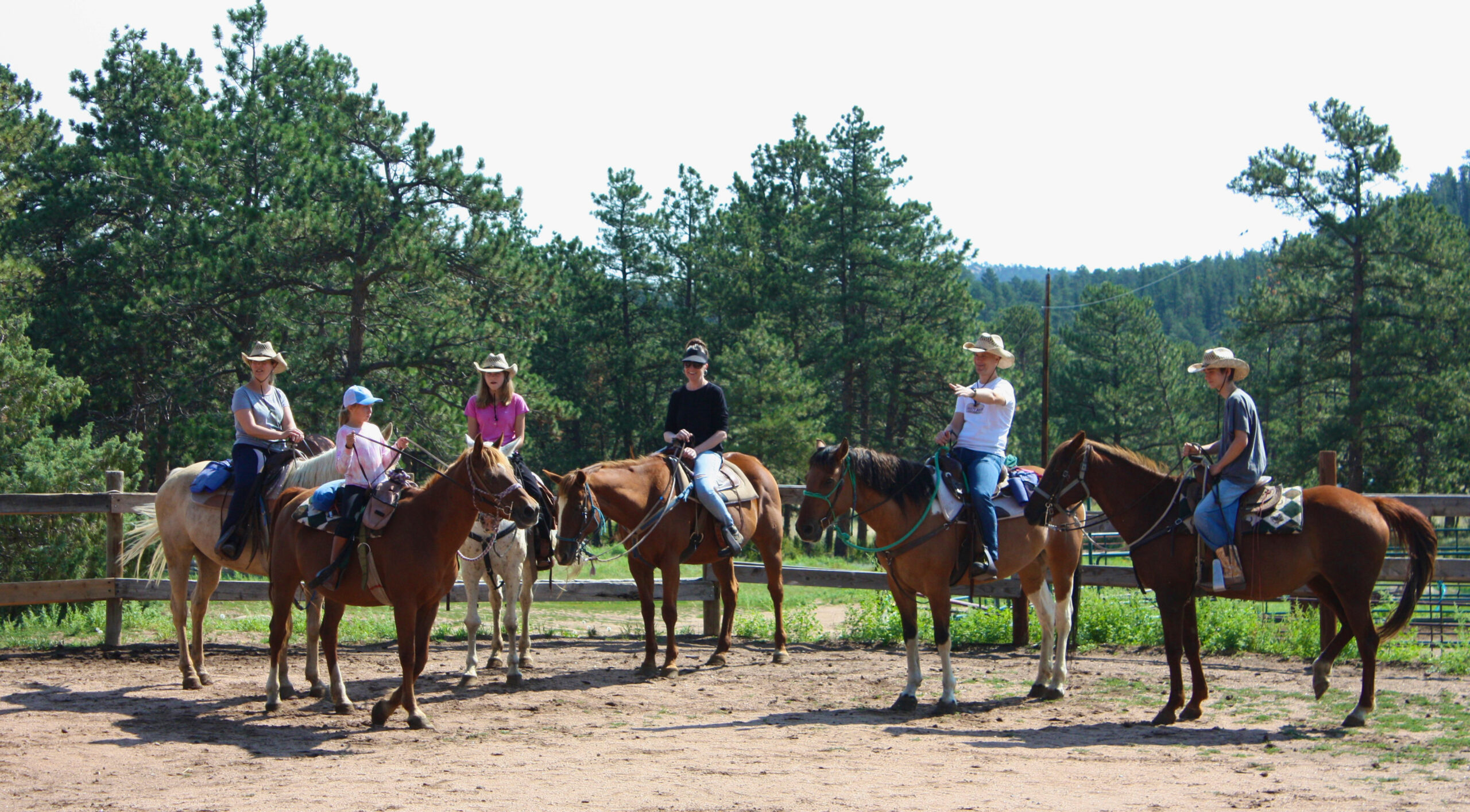 family on horses at the ranch