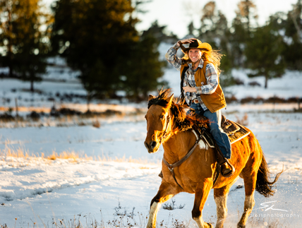 Several riders prepare to embark on a snowy trail ride at Sundance Trail Guest Ranch, enjoying a winter adventure.